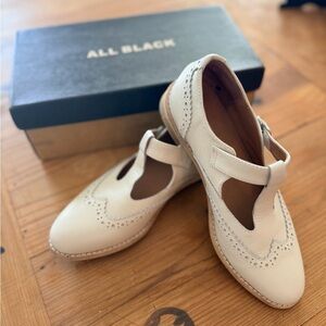 All Black brand  Women's Cream Wing-tip Mary Jane’s
